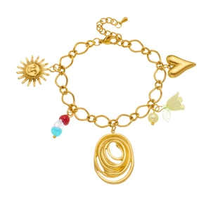 Gold multi-charm bracelet with sun, heart, flower, and colorful acrylic beads on white