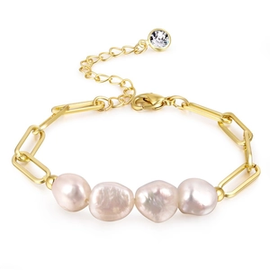 Close-up of gold paperclip chain bracelet featuring baroque pearls and crystal charm