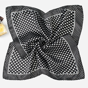 Polka dot silk square scarf in black and white with a glossy satin finish texture