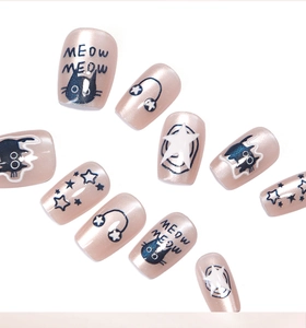 Close-up of pink cat-eye press-on nails with cute cat and star patterns for manicure