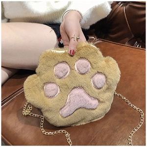 Detail of soft plush bear paw bag with pink paw pads and golden metal chain strap