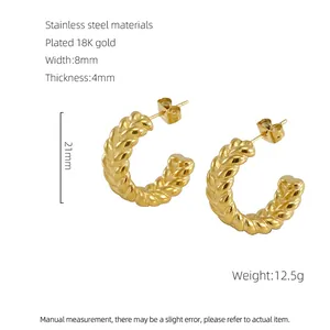 Detailed view of 18K gold plated stainless steel C-shape twisted hoop earrings