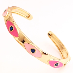 Detailed close-up of C-shaped enamel evil eye cuff bracelet with pink finish