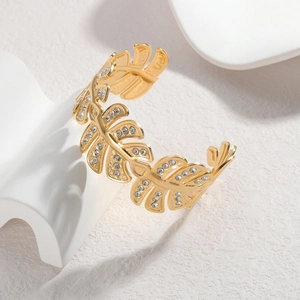 Adjustable gold tropical leaf cuff bracelet with sparkling white crystals for women