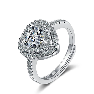 Adjustable silver heart ring featuring a large sparkling cubic zirconia with double halo