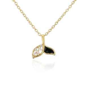 Macro detail of whale tail pendant with sparkling zircons and black enamel finish
