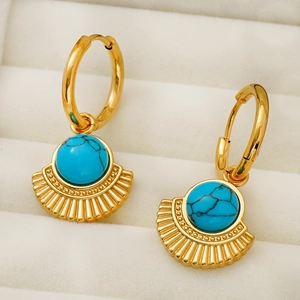 Bohemian style gold earrings with blue turquoise stones and fan shaped metal charms