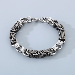 Detail view of Byzantine chain link pattern on two-tone stainless steel men's bracelet