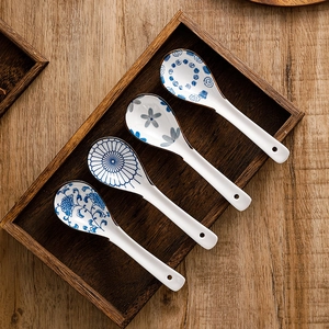 Set of four Japanese style ceramic soup spoons with blue and white floral patterns