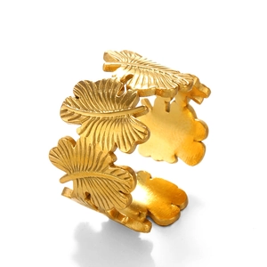 Gold stainless steel open leaf ring featuring an adjustable wrap-around feather design