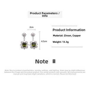 Detail view of oval flower earrings with green zircon showing 2cm width and 4.5cm length