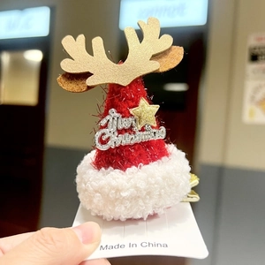 Christmas mini knitted hat hair clip with golden reindeer antlers and stars detail
