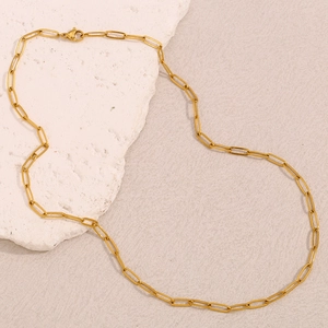 Detail shot of a minimalist 18K gold-plated paperclip chain necklace with lobster clasp