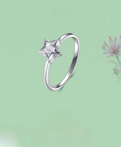 Detailed shot of S925 sterling silver ring with star-shaped zircon and hallmark stamp