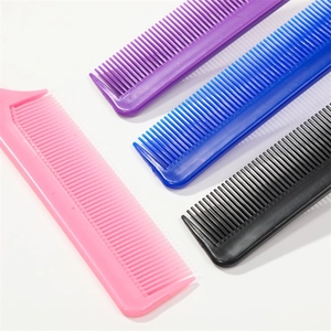 Set of four colorful plastic hair highlighting combs with steel pins on white background