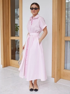 Short-sleeved pink cotton shirt dress with lapels, a matching belt, and A-line midi skirt