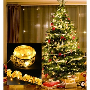 Dual-layer gold Christmas ribbon LED string lights with star patterns on a holiday tree