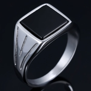 Minimalist silver men's ring with polished square black onyx stone on dark background
