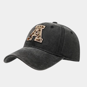 Detail of leopard print letter A embroidery on washed grey cotton baseball cap