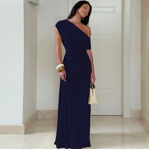 Detail of the elegant asymmetric shoulder design and draped pleats on this dark blue maxi dress