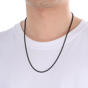 Close-up of a 3mm black braided rope chain necklace worn by a male model on white background