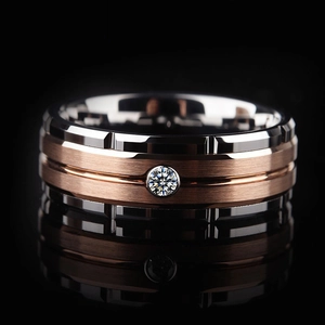 Macro shot of silver and rose gold ring with brushed metal texture and zircon