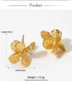 Detail view of gold flower earrings with hammered texture and 30mm size measurements