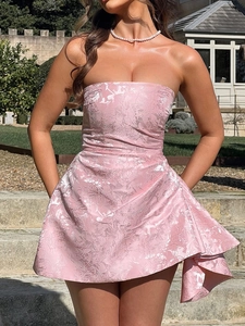 Detail of light pink floral jacquard fabric and waist-shaping design on strapless dress