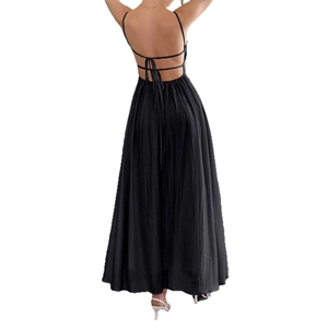 Slim fit black backless maxi dress with thin crossover straps and pleated texture