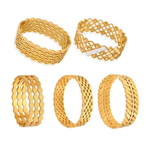 Set of five gold-plated hollow geometric bangles with diamonds and honeycomb patterns