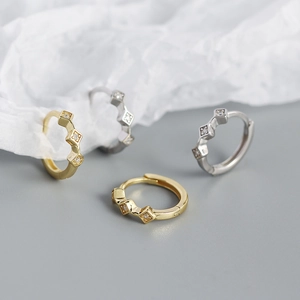 Macro shot of gold and silver S925 rhodium plated geometric diamond earrings set