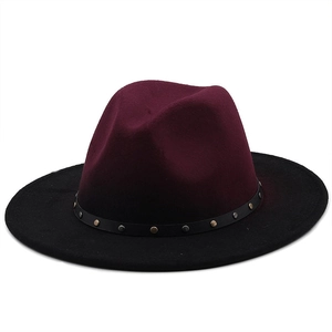 Close-up of burgundy wool fedora with black leather band and silver rivet studs