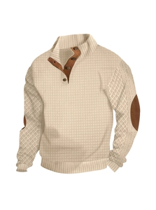 Detailed texture of waffle knit and cable weave on beige men's long sleeve sweater