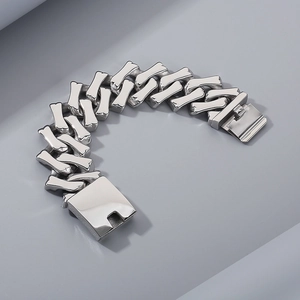 Detailed view of silver titanium steel Cuban chain bracelet with a secure box clasp