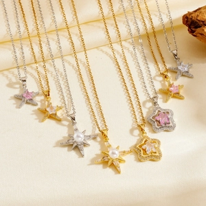 Detail view of gold and silver star and starfish necklaces with zircon and pearl accents