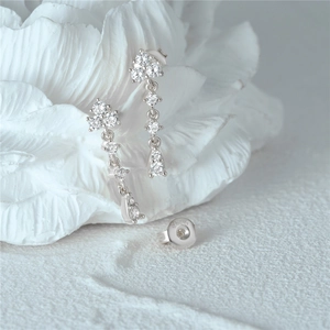 Close-up of S925 sterling silver long tassel earrings with sparkling white cubic zirconia