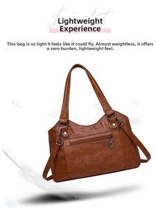 Détail du sac cabas en cuir marron léger avec fermeture éclair et anneau en D métal