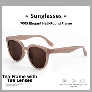 Detail view of oval retro sunglasses model 7005 with tea colored frames and tea lenses