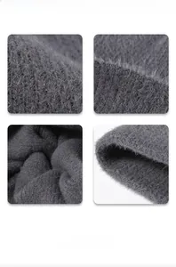 Close-up of the thick dark grey feather yarn knit texture and fluffy fuzzy material