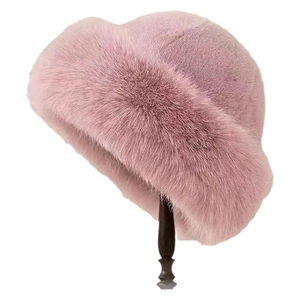Pink faux fur winter bucket hat for women with thick plush thermal texture on stand