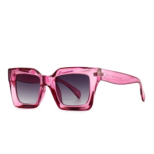 Modern oversized square sunglasses with transparent pink frame and gradient grey lenses