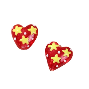 Red heart-shaped glass beads with yellow stars and white dots for DIY jewelry making