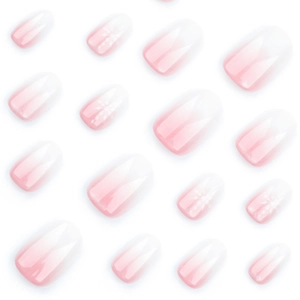 French gradient pink and white press-on nails with delicate winter snowflake designs