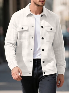 Detail shot of men white waffle knit jacket showing texture and black buttons