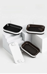 Rotating wall-mounted soap dish with double-layer drainage and adhesive backing