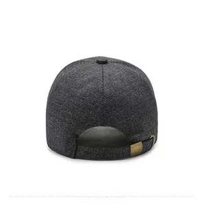Detail of dark grey textured baseball cap with adjustable vintage metal buckle