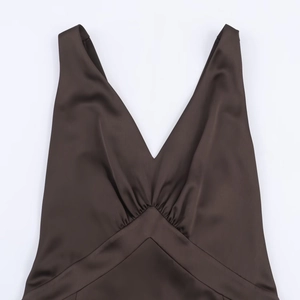 Dark brown satin midi dress with V-neckline and gathered pleat details on white background