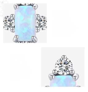 Macro view of 925 sterling silver opal stud earring with zircon accents and prong setting