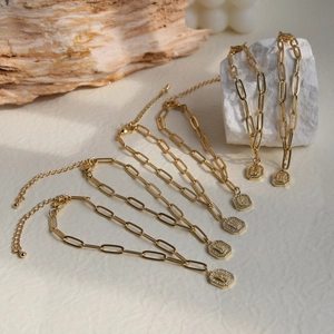 18K gold plated paperclip chain bracelet with a sparkling crystal alphabet square pendant