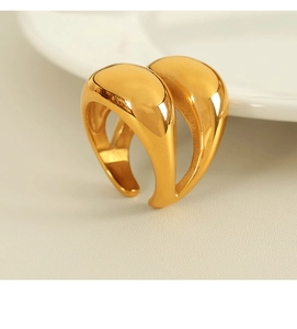 Macro shot of 18K gold plated sculptural double-layer chunky ring with glossy finish